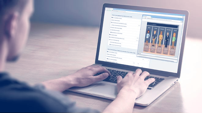 Man operating laptop computer.