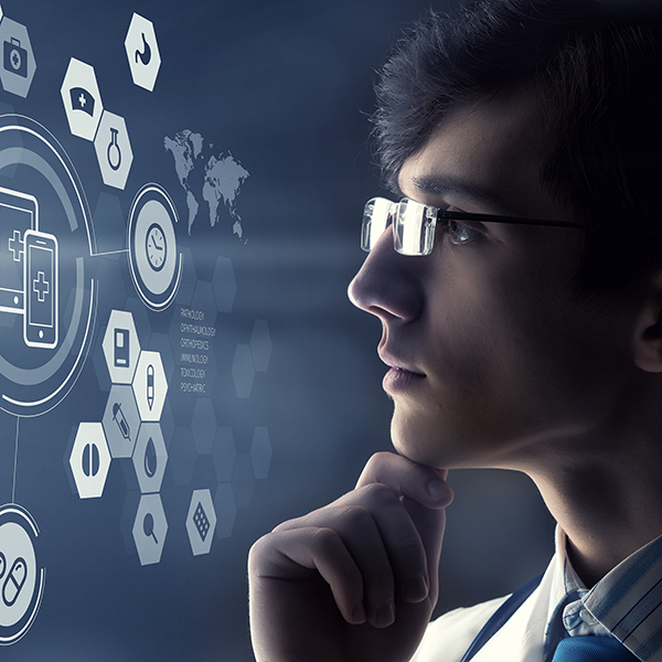 male medical professional looking at a digital screen