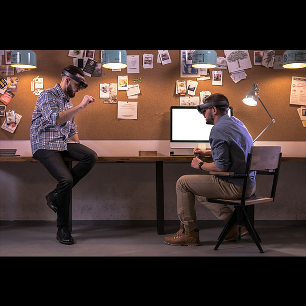 two make colleagues working with VR headsets