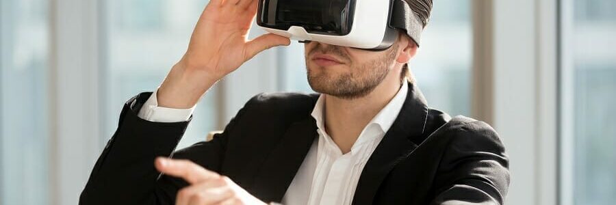 Man wearing VR headset and pointing at the air