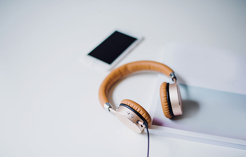 pair of headphones on a white desk