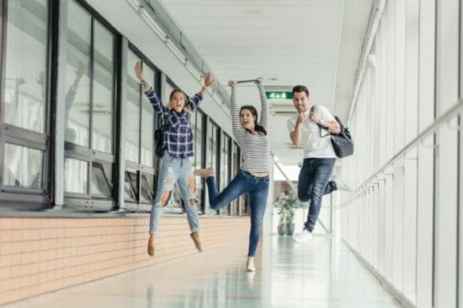 activelearning students jumping in a school hallway