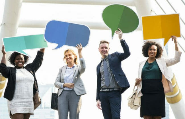 Successful business people with speech bubbles