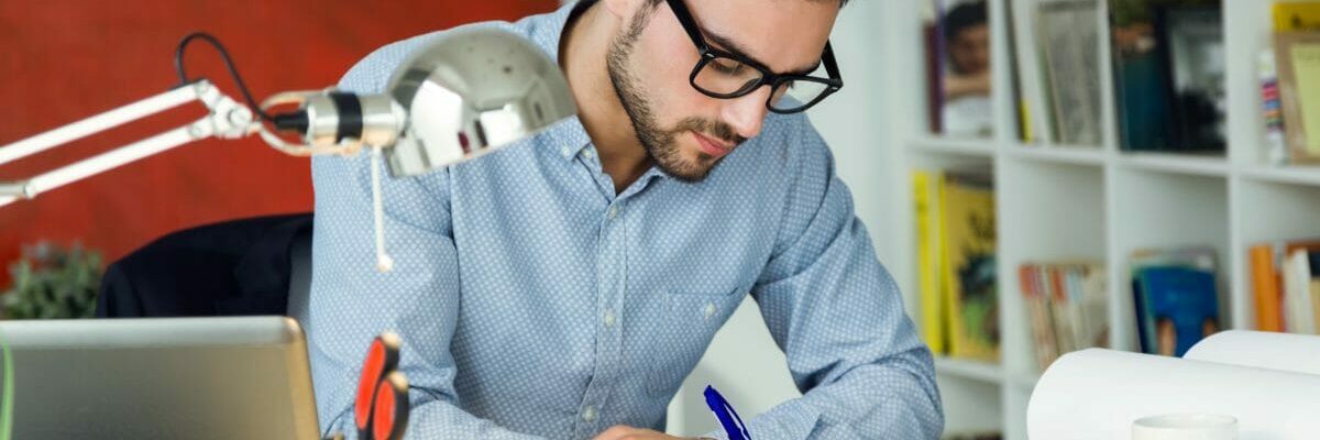 Handsome young businessman working in the office.