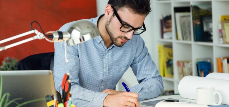 Handsome young businessman working in the office.