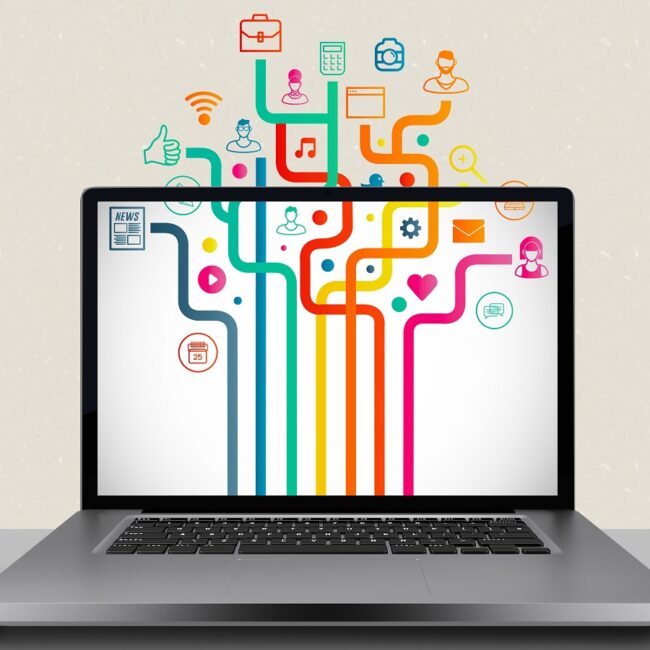 Composite image of a laptop with graphic icons on the screen Composite image of a laptop with graphic icons on the screen