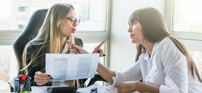 Two young woman in a meeting