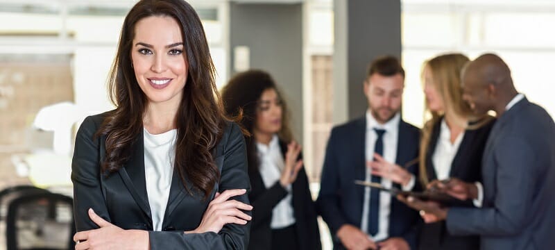 Businesswoman leader in modern office with businesspeople workin