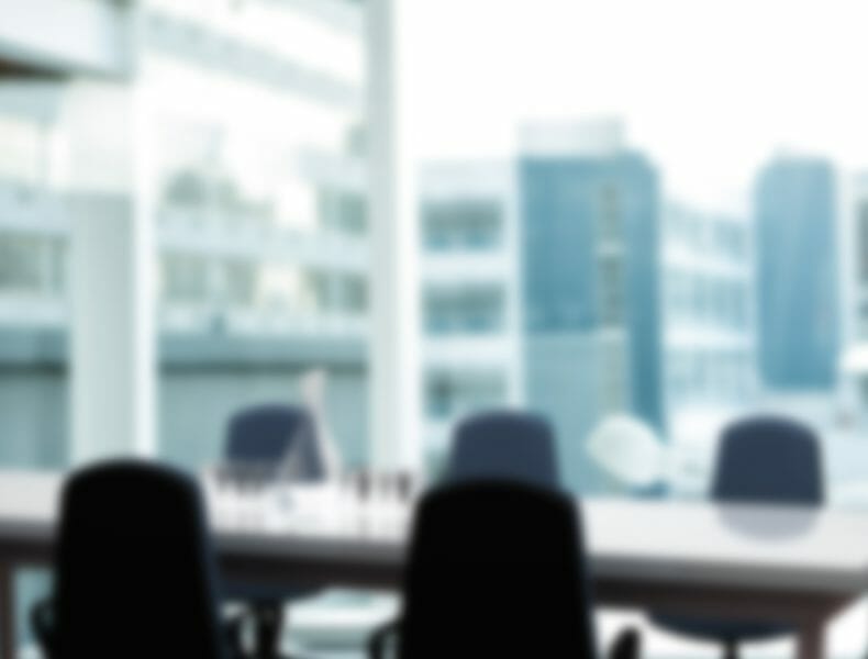 Female executive standing with arms crossed