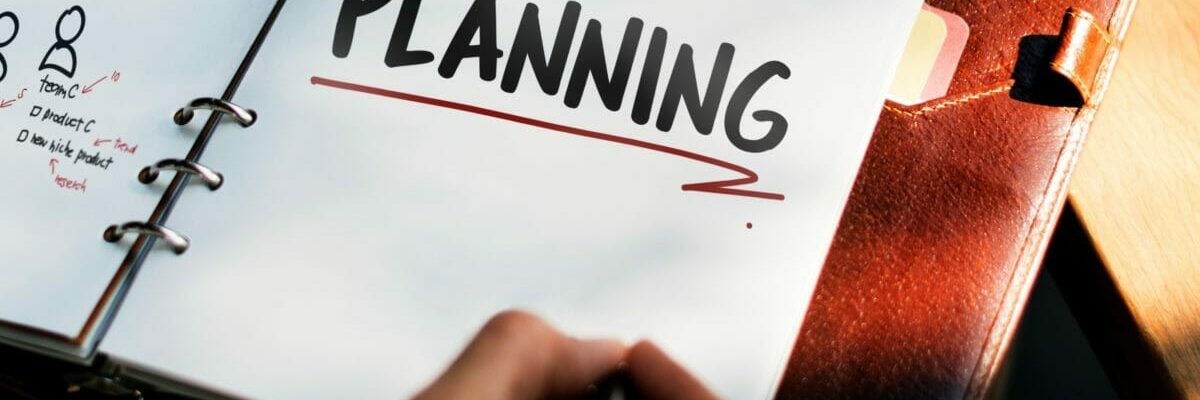 Woman writing and planning business strategy