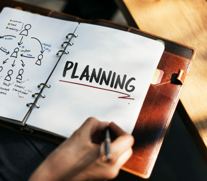 Woman writing and planning business strategy