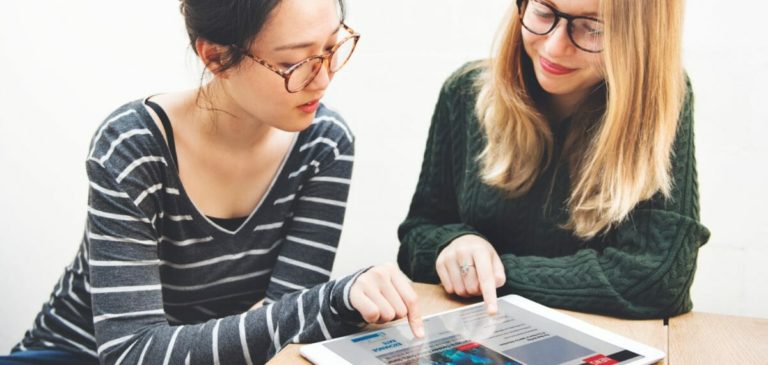 Women Friendship Digital Tablet News Networking Concept