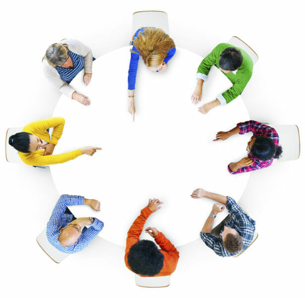 Aerial view of hands pointing in design space area