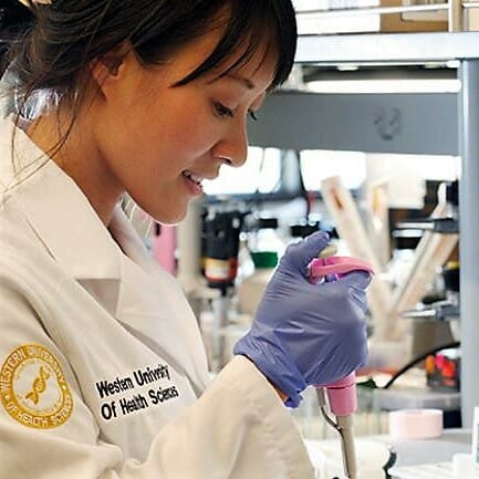 Close up of a female student using biomedical tool