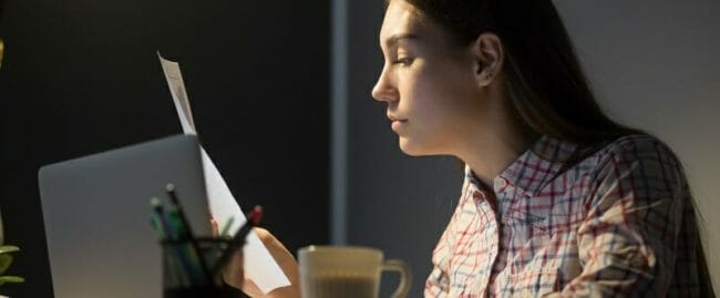 Female worker analyzing company financial reports