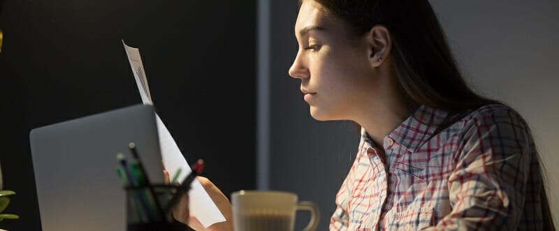 Female worker analyzing company financial reports