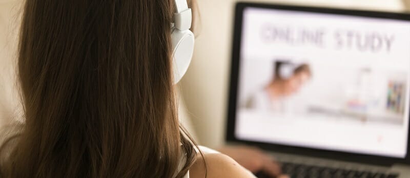 Female student choosing course for distance learn Female student choosing course for distance learn