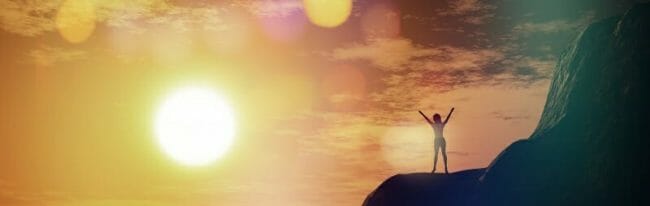 3D female on top of a cliff against a sunset sky 3D female on top of a cliff against a sunset sky