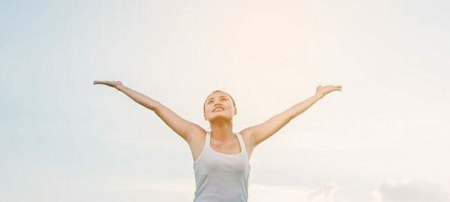 Beautiful Woman feeling free in a beautiful natural setting.