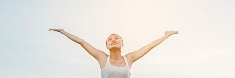 Beautiful Woman feeling free in a beautiful natural setting.