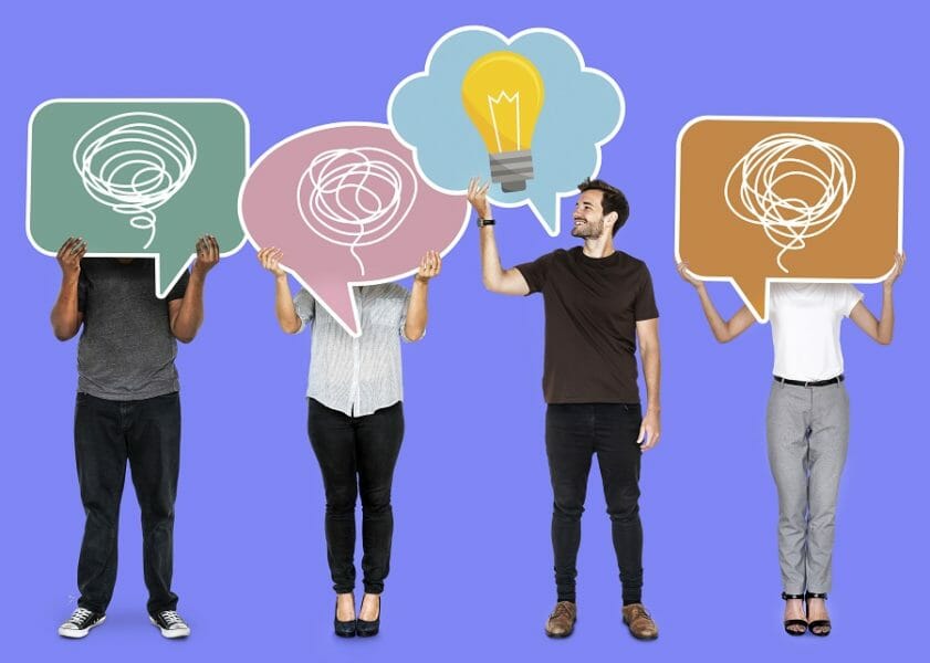 Creative man showing a light bulb symbol in a speech bubble