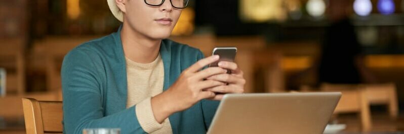 Young man checking phone messages