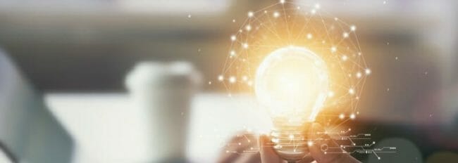 Hand holding light bulb with innovative and creativity are keys to success. Concept knowledge leads to ideas and inspiration. Hand holding light bulb with innovative and creativity are keys to success. Concept knowledge leads to ideas and inspiration.