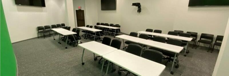 Bartlett-Flex Empty classroom with rows of table and chairs inside Bartlett-Flex building