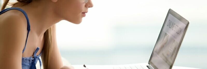 Female student studying online with laptop Female student studying online with laptop