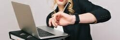 Work office busy time of blonde young woman in formal clothes with laptop, folder talking on phone on white background. Astonished, working, profession, secretary, office worker, manager.